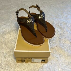 Michael Kors sandals, size 9, brown with MK on it. NWT.